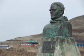 Bust of Einar Mikkelsen (1880-1971) overlooking the inuit settlement of Scoresbysund. East Greenland. 2005