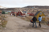 Young Inuit women hurry to the church in Scoresbysund where there will be a wedding. East Greenland. 2005
