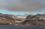 The helicopter flies over the Inuit village of Scoresbysund on the coast of Scoresbysund Fiord. East Greenland. 2005