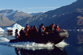 Tourist zodiac cruises amongst icebergs in Fhn Fiord, Scoresbysund Fiord. East Greenland. 2005