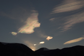 Nacreous, Mother of Pearl, or PSC, Polar Stratospheric Clouds. Believed to be ice and Nitric acid, these react to produce clorine & bromine, from CFCs, which directly destroy ozone molecules. East Greenland. 2005