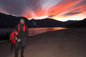 Tour leader Thor on the beach at the end of a fine evenings hike with sunset. Rypefjord. East Greenland. 2005
