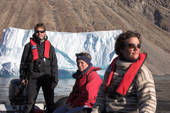 Tourists and driver Zodiac cruise around some icebergs in Nordvest Fjord. East Greenland. 2005