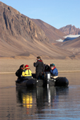 Tourists photograph from Zodiac in Drmmebugten, Bay of Dreams, off Kong Oskars Fjord in East Greenland. 2005