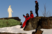 Snowmobilers visit the life sized statue of Christ that welcomes returning fishermen Lulea. Sweden. 2003