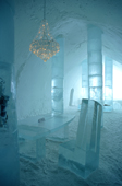 Chandelier hangs above the ice table in the Ice Hotel. Jukkasjarvi. Sweden. 2003