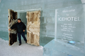 Visitor at the reindeer skin covered door to the Ice Hotel. Jukkasjarvi. Sweden. 2003