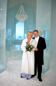 Swedish Bride and Groom in the Ice Hotel Hall after their wedding in the Ice Chapel. Jukkasjarvi. Sweden. 2003