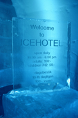 Ice Hotel sign embedded in ice and lit with blue light at night. Jukkasjarvi. Sweden. 2003