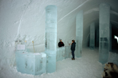 Reception area in the Ice Hotel with ice desk and warmly dressed receptionist. Jukkasjarvi. Sweden. 2003