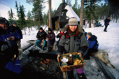 Coffee and cakes at a hut in the forest during a dog sled trip. Jukkasjarvi. Sweden. 2003