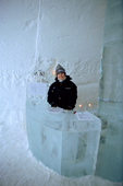 Reception area in the Ice Hotel with warmly dressed staff at the ice desk. Jukkasjarvi. Sweden. 2003