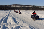 Snowmobile trip along the Torne River near Jukkasjarvi, Sweden. 2003