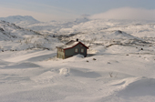 Isolated Cabin in the mountains above Natvik in winter. Norway. 2003