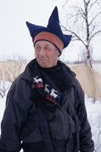 Sami reindeer herder wearing the traditional hat of the four winds from the Karasjok region. Sapmi. Norway. 2000