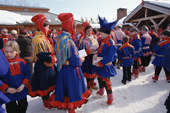 Sami women congratulate a youth in a traditional hat at his confirmation. Karasjok. Sapmi. N. Norway. 2000