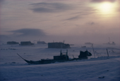 A storm at the Inuit hunting camp of Narsarssuk in Bylot Sound, with dog sleds in foreground. Avanersuaq, Thule, Northwest Greenland. 1980