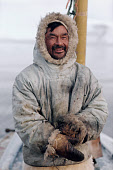 Tukaak, an Inuit hunter, out seal hunting in a boat during the autumn. Moriussaq. Northwest Greenland. (1987)