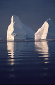 Iceberg floating in a calm ice free summer sea. North West Greenland. 1987