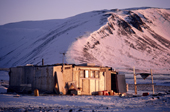 Last light before the sunset on the homebuilt house of an inuit hunter in Moriussaq. NW Greenland. 1987