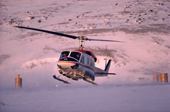 Helicopter carrying post and passengers takes off from Moriussaq. N.W. Greenland. 1987