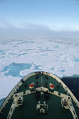 The bow of the Russian icebreaker Kapitan Dranitsyn cutting through sea ice. Franz Josef Land. 2004