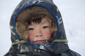 Igor Serotetto, a Nenets boy, warmly dressed against the winter cold. Yamal. NW Siberia, Russia