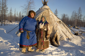 Elderly Nenets couple, Sergey Serotetto and his wife Galla, standing outside their tent at a reindeer herders' camp. Yamal, NW Siberia, Russia