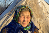 Elderly Nenets woman, Galla Serotetto, outside her family's tent at a reindeer herders' camp. Yamal, NW Siberia, Russia