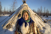 Elderly Nenets woman, Galla Serotetto, outside her family's tent at a reindeer herders' camp. Yamal, NW Siberia, Russia