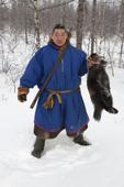 Leova Serotetto, a Nenets reindeer herder, holds a dead wolverine that he shot near his family's reindeer herd. Yamal, NW Siberia, Russia