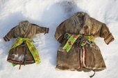 Two Nenets idol figures called 'Myadpukutsya' (old woman of the tent) who protects the family and promote fertility. A new belt is added to the figure every time a child is born into the family. Yamal, NW Siberia, Russia