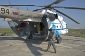 Supplies being loaded into a MI-8 helicopter at Gyda. Tazovsky region, Gydan Peninsula, Yamal, Siberia, Russia