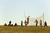Nenets children, well covered up against mosquitoes, playing volleyball at a fishing camp on the Yuribey River.The net is made from a fishing net. Gyda, Tazovsky Region, Gydan Peninsula, Yamal, Siberia