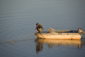 A Nenets fisherman, checking a net he has set on the Yuribey River. Tazovsky region, Gydan Peninsula,Yamal, Siberia