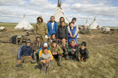 A group of Nenets reindeer herders & their families, pose for a photo at their summer camp near Cup Lake. Gyda, Tazovsky region, Yamal, Siberia, Russia