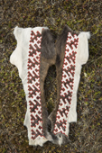 A traditional Nenets design,of inlaid fur sewn onto the leg skins of reindeer. It will be used as decoration on a traditional Yakushka (woman's reindeer skin coat). Gyda, Tazovsky region, Yamal, Siberia, Russia