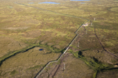 Aerial view of an oil pipeline crossing tundra in the Tazovsky region of the Gydan Peninsula. Yamal, Siberia, Russia
