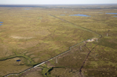 Aerial view of an oil pipeline crossing tundra in the Tazovsky region of the Gydan Peninsula. Yamal, Siberia, Russia