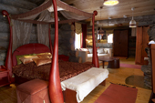 A bedroom suite in the log cabin Hotel Kakslauttanen, Suite, Kakslauttanen, Lapland, Finland.
