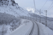 The tracks of the Kiruna-Narvik iron ore railway in winter. Lapland, Sweden.
