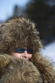 Woman in a fur hat. Kiruna, Lapland, Sweden. MR