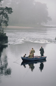 Fishing from a boat on a misty morning. Campsie Lin. River Tay. Scotland.